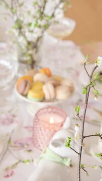 Spring Easter decor. Easter table setting. Flowers and dishes and candles for a festive dinner. High quality footage