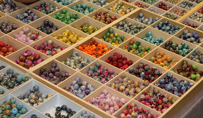 colorful beads ideal for adorning necklaces and customizing them in the hobby shop