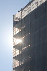 scaffolding of the condominium during maintenance to install the thermal insulation for energy saving against the light