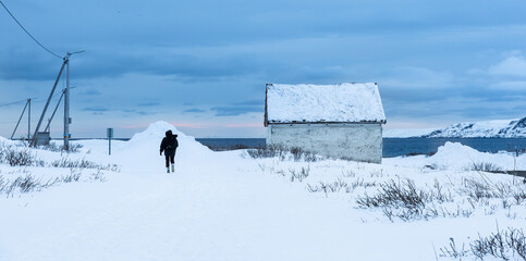 snow covered seaside shore in Vardo, Norway