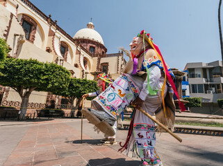 Danza de los viejitos, traditional Mexican dance originating from the state of Michoacan, Mexico. Dancing in front of the church.