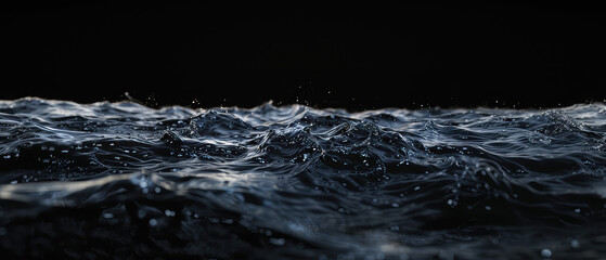 Black water surface with glistening droplets