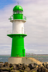 The lighthouse on the western pier of Warnemünde in Mecklenburg-Western Pomerania, Germany