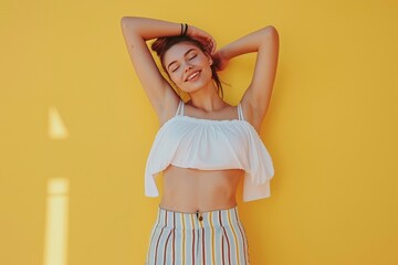 Woman in White Tank Top and Yellow Striped Pants