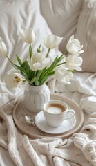 Obraz na płótnie Canvas White Vase With White Flowers and Coffee Cup