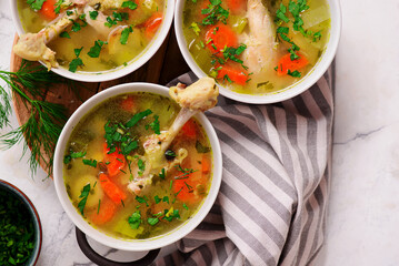 Vegetable soup with baked chicken and lemon .top veiw .style hugge