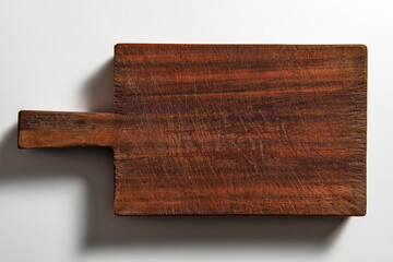 Isolated empty rectangular wooden chopping board