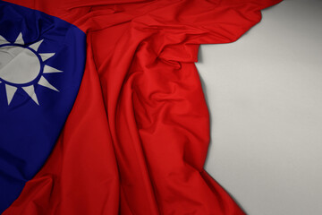 waving national flag of taiwan on a gray background.
