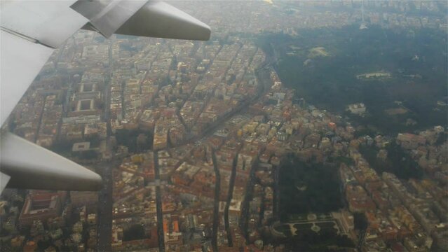 plane flies over Italy on approaching Rome.