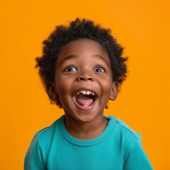 Exuberant young African American child laughing with joy, curly hair bouncing against a lively orange background.