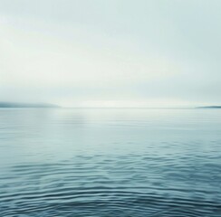 Obraz premium Large Body of Water Under a Cloudy Sky