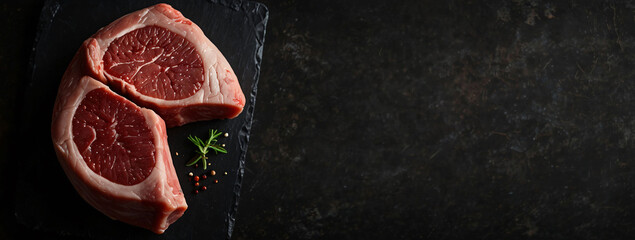Meat steak. Beef steak dry aged with spices on black background. Top view.Place for text, empty space.