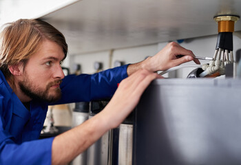 Handyman, plumber and tools in maintenance with spanner, pipes and repair at work and job in home....