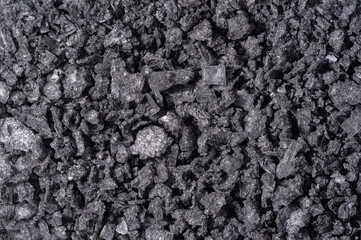 Heap of small stones of black salt used in cooking seasonings