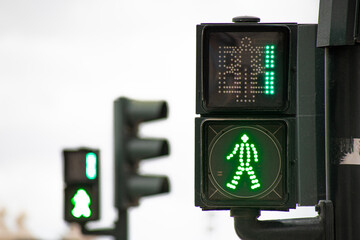 Green traffic light for pedestrians counting down in 1 seconds in Lisbon-Portugal