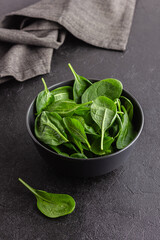 Fresh green spinach leaves in the bowl. Natural vegetarian food.