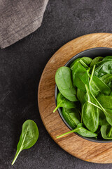 Fresh green spinach leaves in the bowl. Natural vegetarian food.