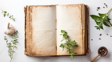 Blank aged cookbook pages on a white background with kitchen herbs. Empty old book template for culinary designs with copy space. Mom's recipe book on a white background