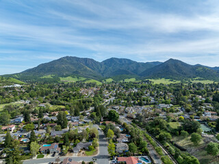Drone landscape photos over the beautiful landscape of Clayton, California with homes, streets and...