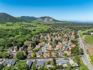 Drone landscape photos over the beautiful landscape of Clayton, California with homes, streets and...