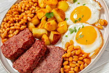 corned beef, baked beans, potatoes and fried eggs