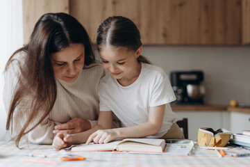 Mother and Daughter Studying Together - obrazy, fototapety, plakaty