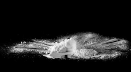 White powder isolated on black background, side view with clipping path	