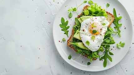 Avocado toast with poached egg, greens on white plate, top view, ideal breakfast concept - obrazy, fototapety, plakaty
