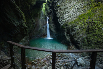Caporetto, Slovenia. Kozjak waterfalls. Nature trail along the river with crystal clear, turquoise...