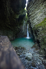 Caporetto, Slovenia. Kozjak waterfalls. Nature trail along the river with crystal clear, turquoise...