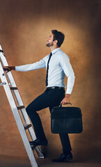 Businessman, climbing and corporate ladder in studio for work opportunity, promotion and goal....