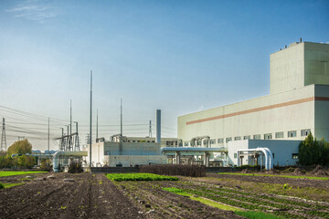 Large Cooling Tower at Industrial Plant on Sunny Day