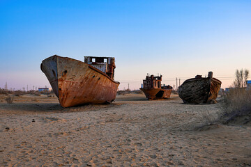 Rusty shipwreck lying on the seabed of the dried-up Aral Sea in Moynaq (or Muynak), a former...