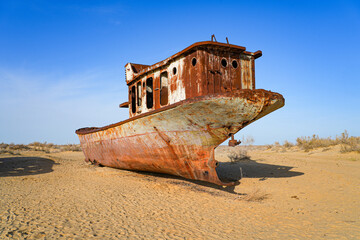Rusty shipwreck lying on the seabed of the dried-up Aral Sea in Moynaq (or Muynak), a former...
