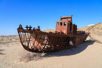 Rusty shipwreck lying on the seabed of the dried-up Aral Sea in Moynaq (or Muynak), a former...