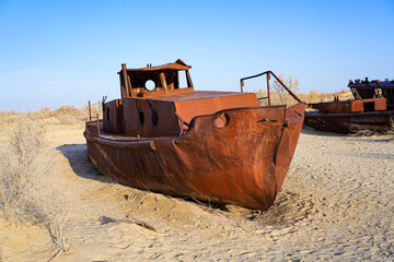 Rusty shipwreck lying on the seabed of the dried-up Aral Sea in Moynaq (or Muynak), a former...