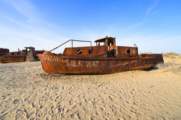 Rusty shipwreck lying on the seabed of the dried-up Aral Sea in Moynaq (or Muynak), a former...