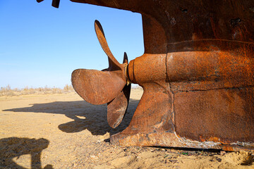 Rusty shipwreck lying on the seabed of the dried-up Aral Sea in Moynaq (or Muynak), a former...