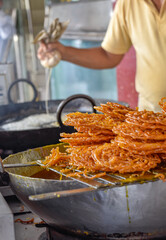 Traditional Jalebi. Indian desserts in pastry shop and street food on markets
