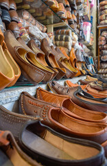 Traditional Rajasthan shoes of different colors in street markets.