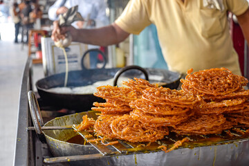Traditional Jalebi. Indian desserts in pastry shop and street food on markets