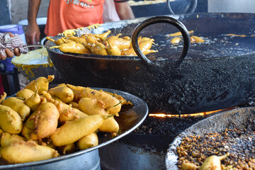 Traditional Mirch Pakoras Indian food as Samosas fried on street food and market