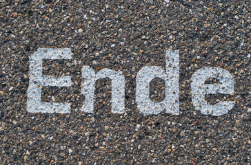 Road Sign Painted on Textured Concrete Surface 'Ende'