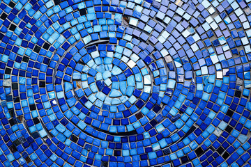 A blue mosaic tile wall with a blue and white swirl pattern.