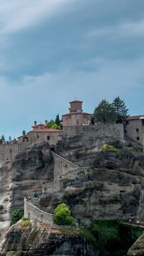 Timelapse of Monastery of Great Meteoron monastery in famous greek tourist destination Meteora in Greece. Camera zoom out effect