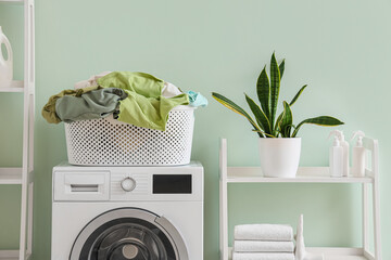 Laundry basket on washing machine in room