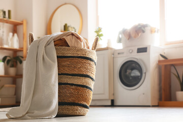 Full laundry basket on floor in room, closeup