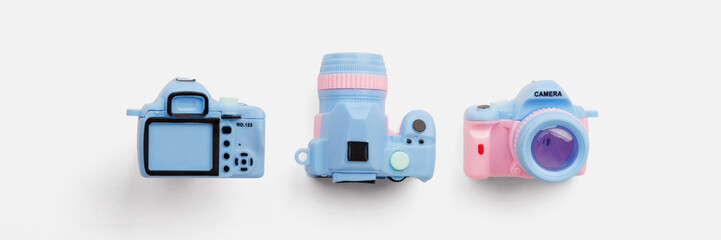 Colorful toy camera on pastel color background
