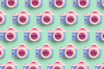 Pattern with SLR camera on pastel color background