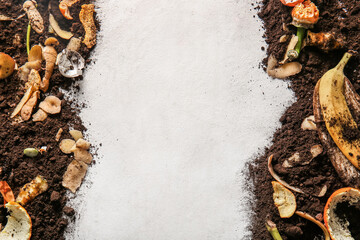 Frame made from organic waste and soil on white grunge background. Compost recycling concept